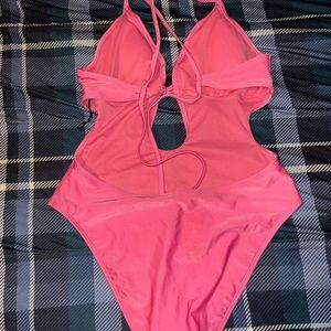 One piece bathing suit, pink, size L, never worn
